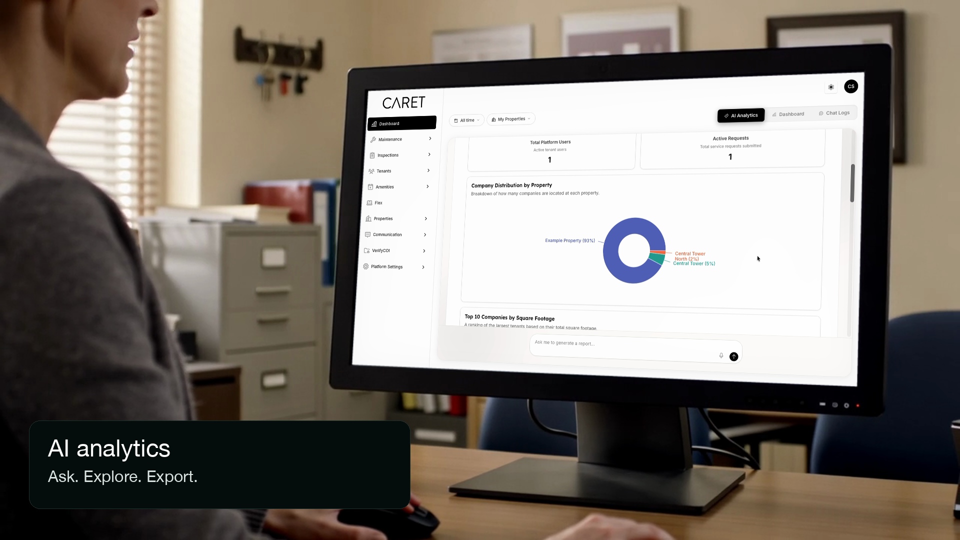 A property team member reviewing the Caret reporting interface on a desktop monitor