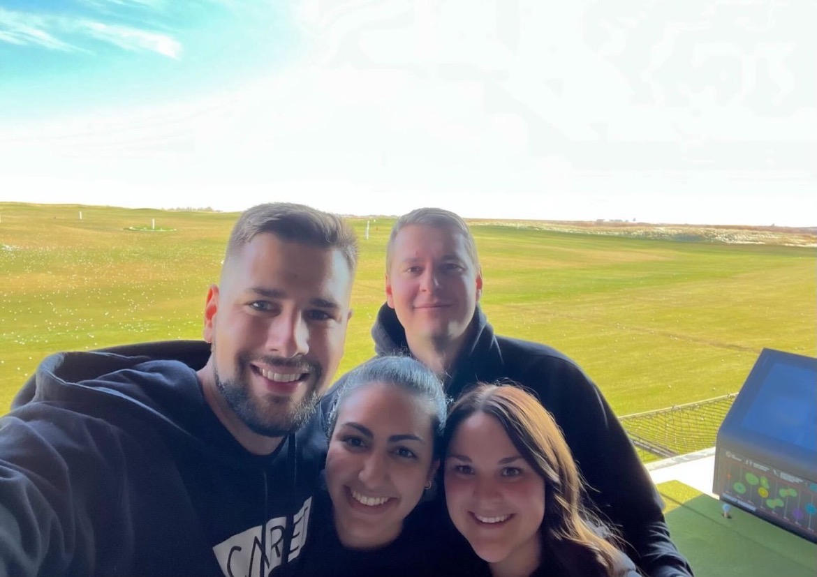Caret team spending time together at a golf event
