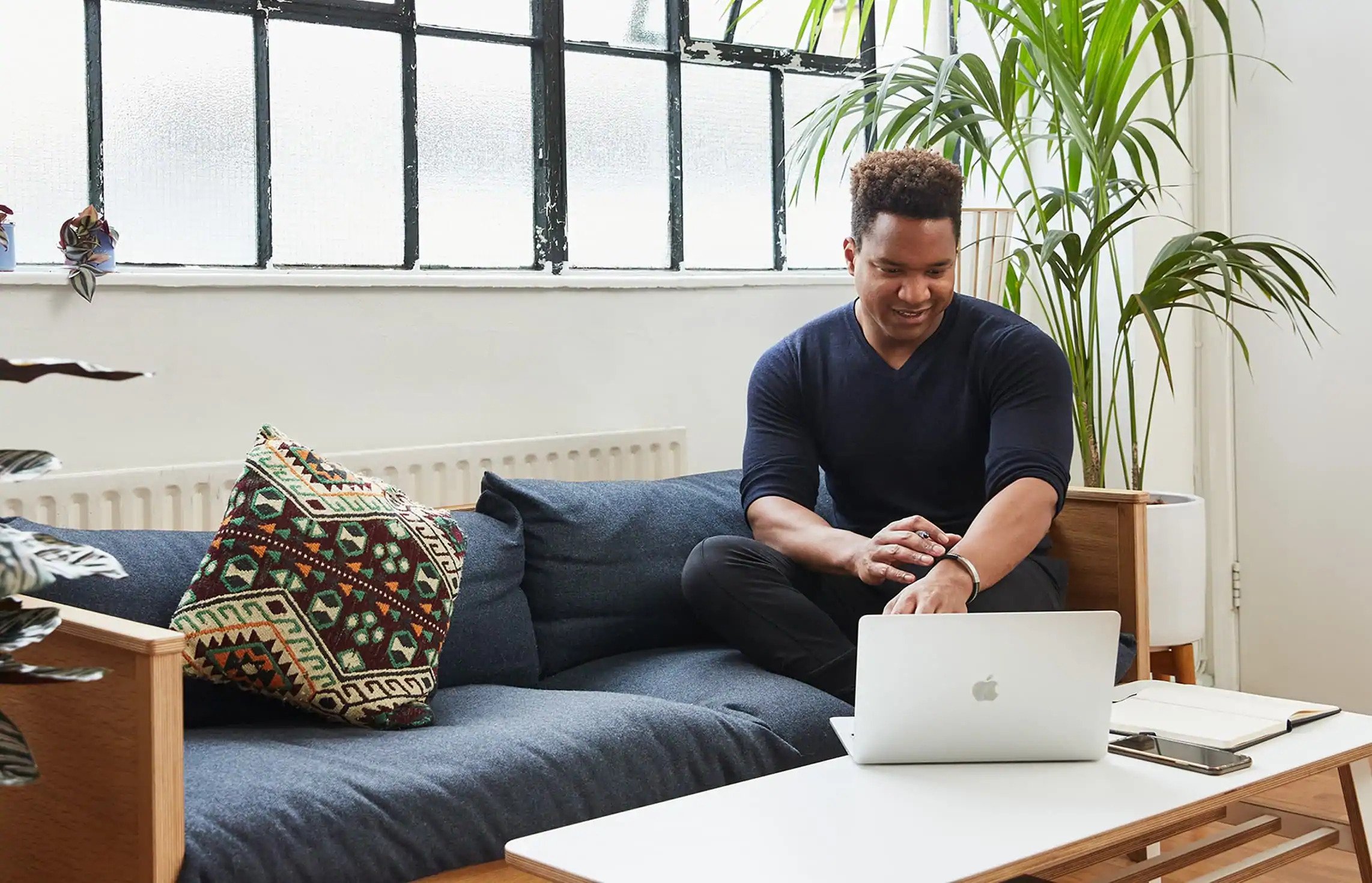 A Caret team member working from a bright collaborative space